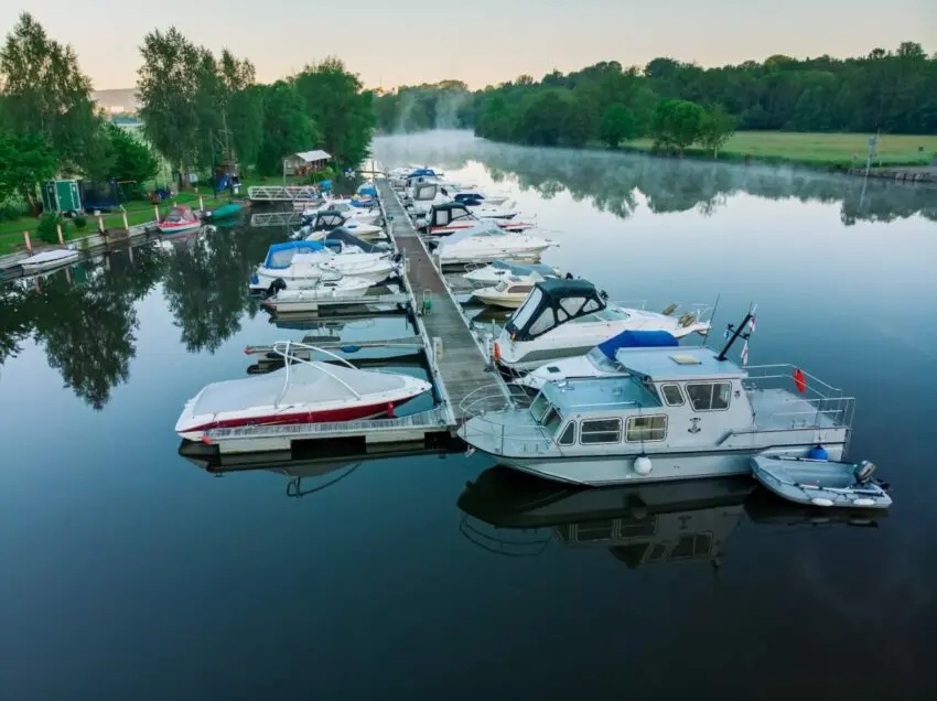 white and red boat on water during daytime